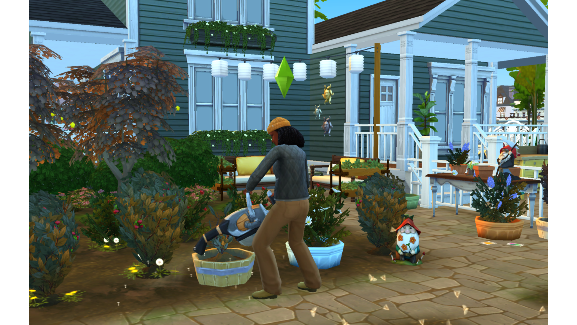 Sims 4 Sim watering plants in a backyard garden with potted flowers, shrubs, and a decorative garden gnome near the house.